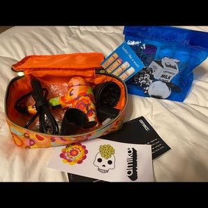 Amika hair care mini products and mini blowdryer with attachments. New.